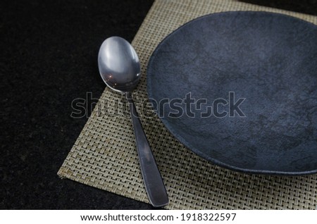 Beautiful empty black slate plate seen from above