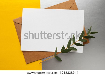 postcard mockup. blank white card with kraft brown paper envelope    Royalty-Free Stock Photo #1918338944