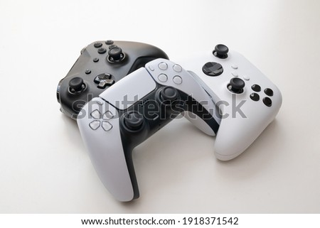Group of next gen game controllers  Royalty-Free Stock Photo #1918371542