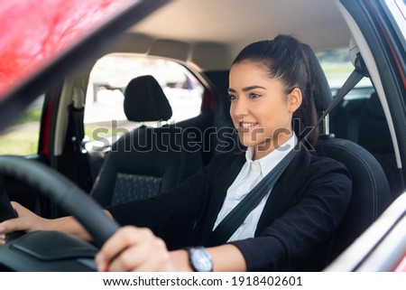 Woman driving her car. Transport concept. Royalty-Free Stock Photo #1918402601