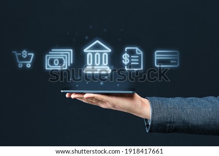 Mobile banking concept. Hand holds smartphone with abstract icons of bank and financial services. Royalty-Free Stock Photo #1918417661