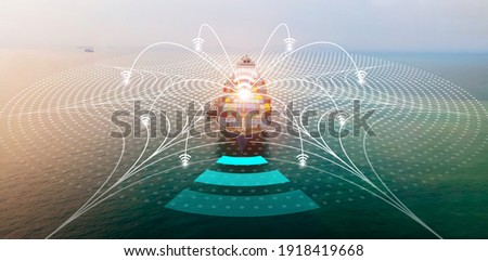 Aerial of cargo ship with WIFI Line technology connection carrying container and running for export  goods  from  cargo yard port to other ocean concept freight shipping ship .  forwarder mast Royalty-Free Stock Photo #1918419668