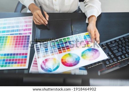 Graphic design using graphics tablet 
drawing creative logo design brand designer sketch with Color swatch samples