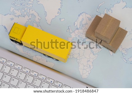 Container truck loading cargo shipping container box with worldmap background use as online tracking technology of worldwide logistic, shipping, import and export concept. Royalty-Free Stock Photo #1918486847