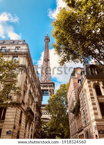 The hiding Paris Eiffel Tower in a sunny day