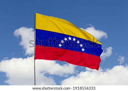 Venezuela flag isolated on the blue sky with clipping path. close up waving flag of Venezuela. flag symbols of Venezuela. Royalty-Free Stock Photo #1918556333