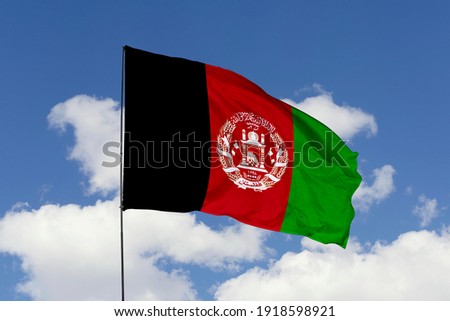 Afghanistan flag isolated on the blue sky with clipping path. close up waving flag of Afghanistan. flag symbols of Afghanistan. Royalty-Free Stock Photo #1918598921