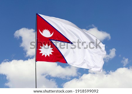 Nepal flag isolated on the blue sky with clipping path. close up waving flag of Nepal. flag symbols of Nepal. Royalty-Free Stock Photo #1918599092