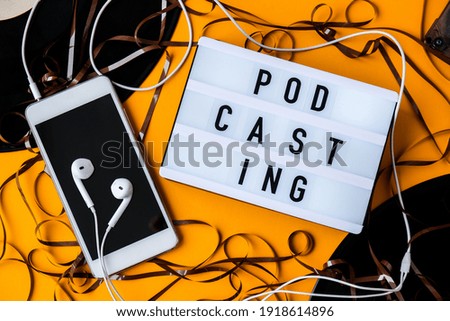 Podcasting lettering and vinyl record audio cassette tape album headphones and mobile phone. Millenial. Blogger, podcaster. Retro style. Audiobooks. New episode available.
