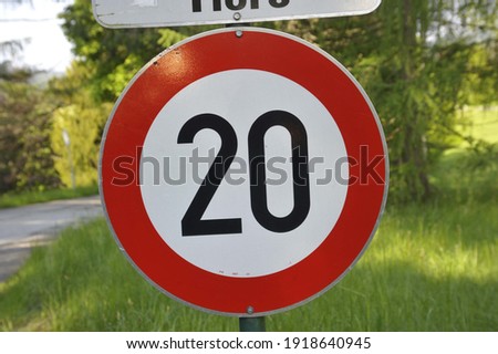 20 kilometers per hour speed limit sign on the street