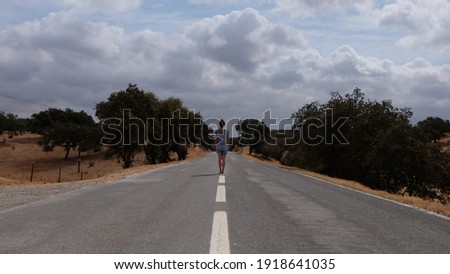 person in the middle of the road, summer day in alentejo Portugal