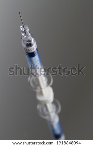 Close up on a small Covid-19 vaccine syringe