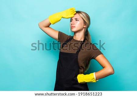 Young woman house wife hold equipment disinfection bucket clean apartment tired wear headband latex gloves apron isolated blue background