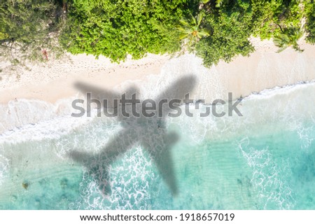 Beach travel traveling vacation sea symbolic picture airplane flying flight Seychelles water image