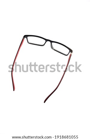 red combination black square glasses in the photo from above. isolated white background
