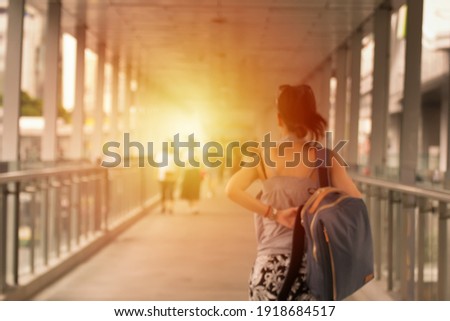 Blurred and soft picture of woman walking in the shopping center on  holiday.