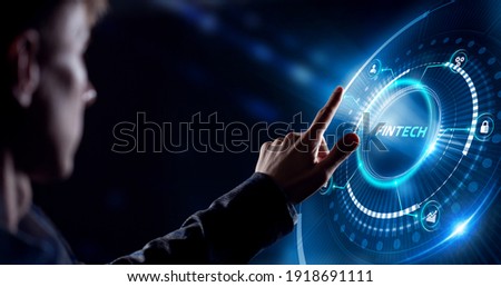 Fintech -financial technology concept.Young businessman  select the icon Fintech on the virtual display. Royalty-Free Stock Photo #1918691111