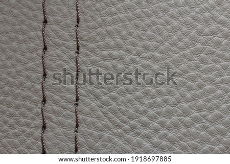 sample of genuine leather with decorative stitching

