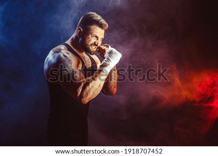 Sportsman boxer fighting on black background with shadow. Copy Space. Boxing sport concept. Smoke on background Royalty-Free Stock Photo #1918707452