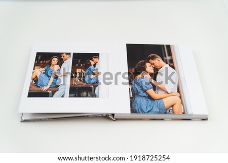 the pages of the photobook from photo shoots of a a beautiful happy couple. grainy paper texture. photo design in the album. Memory. Designer. white background 