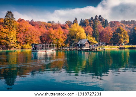 Beautiful Croatian scenery. Excursion ships on the lake. Attractive autumn view of Plitvice lake. Colorful morning landscape of Croatia, Europe. Traveling concept background.