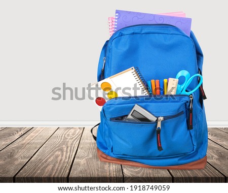 Blue School Backpack  on   background. Royalty-Free Stock Photo #1918749059