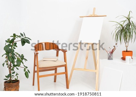 Painting studio with blank canvases and on white background with copy space