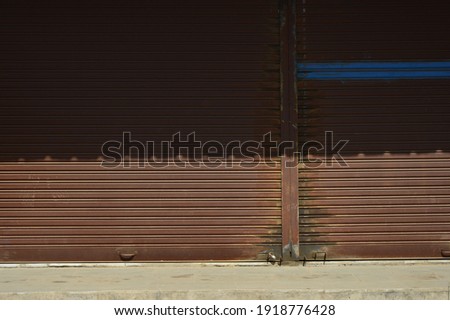 
Old steel shutter door, store, closed, day, street, shop