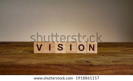 VISION wording on wooden table