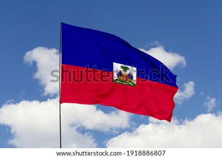 Haiti flag isolated on the blue sky with clipping path. close up waving flag of Haiti. flag symbols of Haiti. Royalty-Free Stock Photo #1918886807