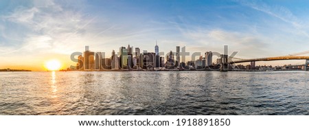 Manhattan Downtown urban view with Brooklyn bridge in sunset