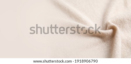 Warm cashmere fabric as background, closeup view with space for text. Banner design Royalty-Free Stock Photo #1918906790
