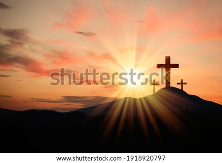 Christian crosses on hill outdoors at sunset.  Crucifixion Of Jesus Royalty-Free Stock Photo #1918920797