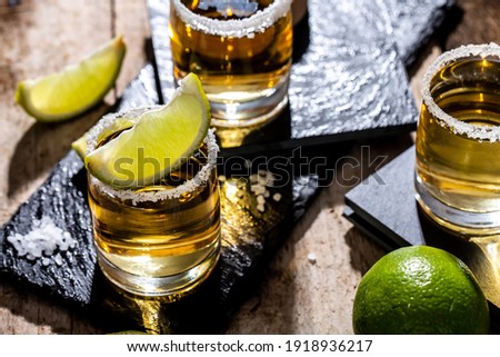 Mexican tequila with lime and salt on black background. space for text. concept luxury drink. Alcoholic drink Royalty-Free Stock Photo #1918936217