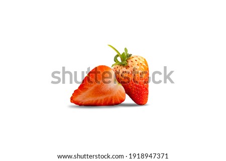 Strawberry fruit with sliced isolated on white background with clipping path. Fresh red strawberries with green leaves.