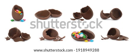 Set with broken chocolate eggs on white background, banner design Royalty-Free Stock Photo #1918949288