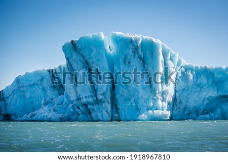 Stunning glacial ice formations in dazzling blues and whites float in a freshwater Icelandic glacial lagoon Royalty-Free Stock Photo #1918967810