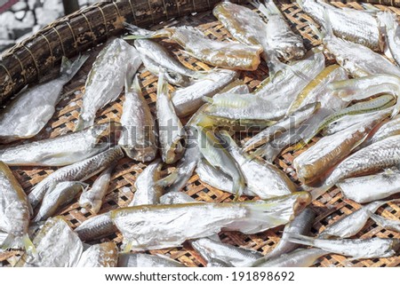 Dried Small fish in bamboo basket