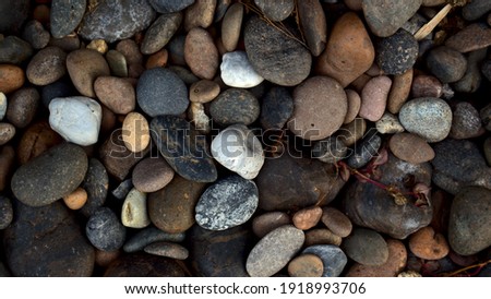 Natural multicolored pebbles stone abstract texture background.