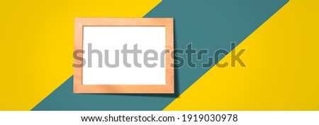 picture frame on the yellow and blue table background