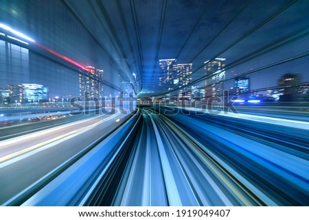 Motion blur of train moving inside tunnel in Tokyo, Japan Royalty-Free Stock Photo #1919049407