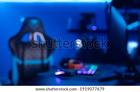 Blurred background professional gamer playing online games computer.