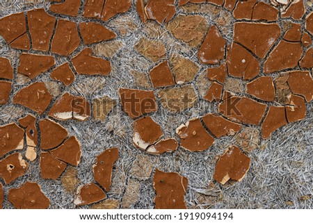 Texture of old cracked artificial leather. The surface of the dried leatherette with lots of cracks and pieces of brown material. Faux leather texture. Great for background and design. High resolution