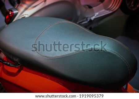 The leather seat of the motorcycle looks luxurious.