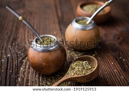 Healthy infused drink, classic Yerba Mate tea in a gourd with bombilla on wooden background Royalty-Free Stock Photo #1919125913