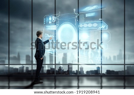 Financial analytics, A man in a business suit, a businessman stands against the background of a hologram with graffiti and data. Mixed media. Financial charts