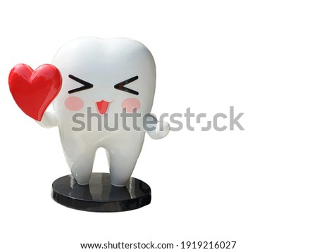 Tooth-shaped stucco holding a red heart on white background