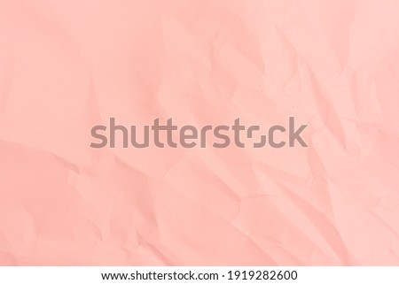 Pink paper background. Crumpled pink paper texture.