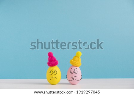 Easter holiday concept with cute eggs with funny faces. Different emotions and feelings. Couple in quarrel