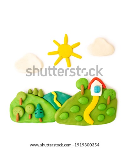 plasticine landscape, meadows, trees, house sun clouds on a white background